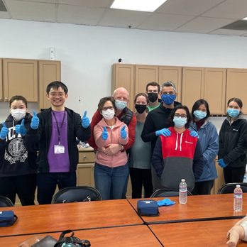 FirstCPR training class giving a thumbs up after completing CPR certification